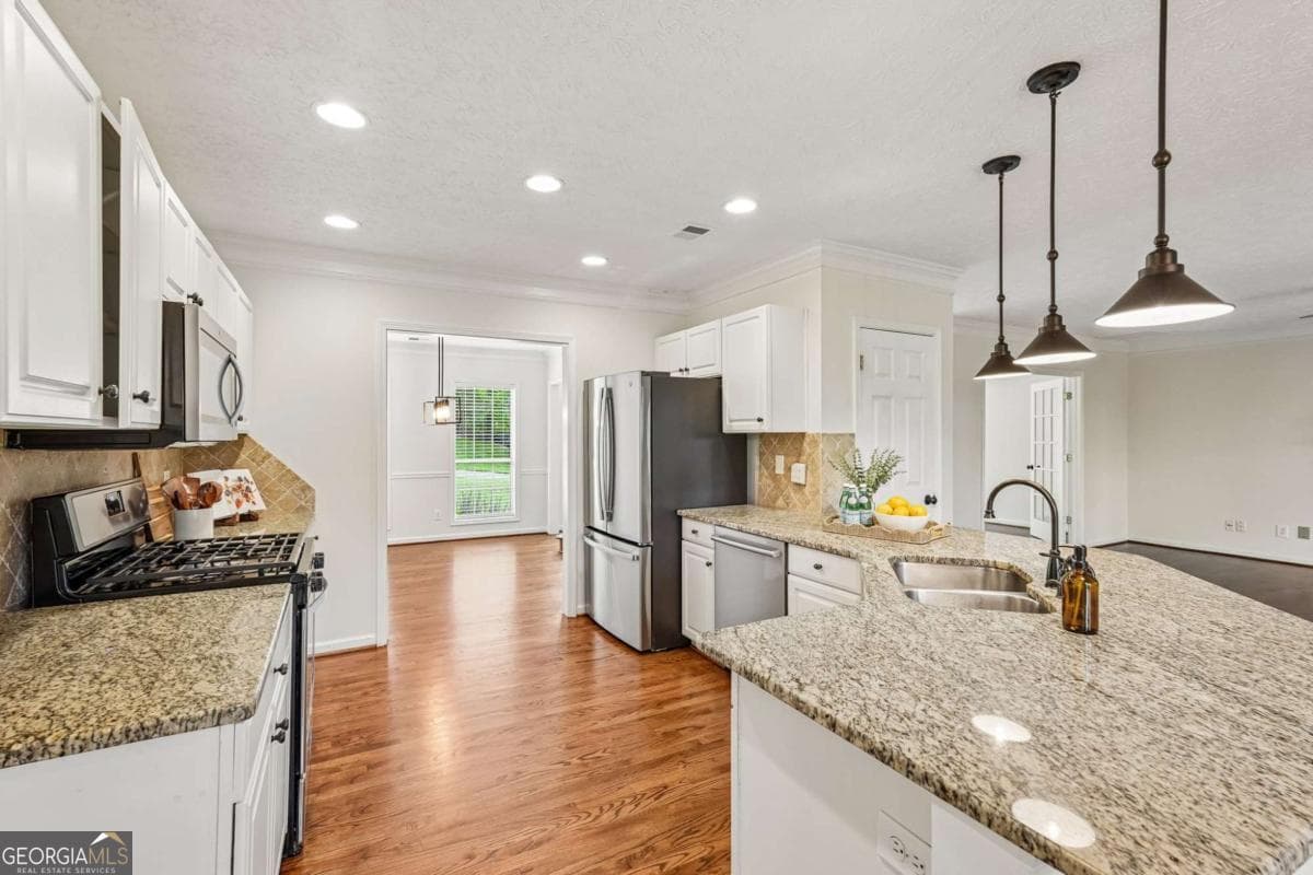 4 bedroom, 2.5 bathroom, 4,000 sq ft single family residence for sale at 5520 Tallantworth Trail, Cumming, GA 30040 — photo 8