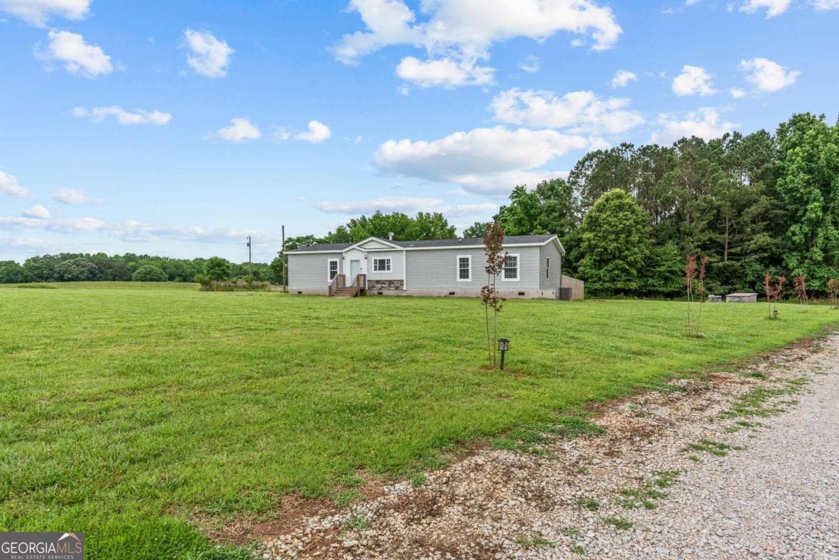 3 bedroom, 2 bathroom, 2,112 sq ft manufactured home,single family residence sold at 1259 Flat Rock Church Road, White Plains, GA 30678