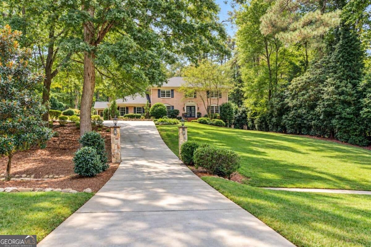 6 bedroom, 5 bathroom, 5,110 sq ft single family residence for sale at 7680 Ryefield Drive, Sandy Springs, GA 30350 — photo 2