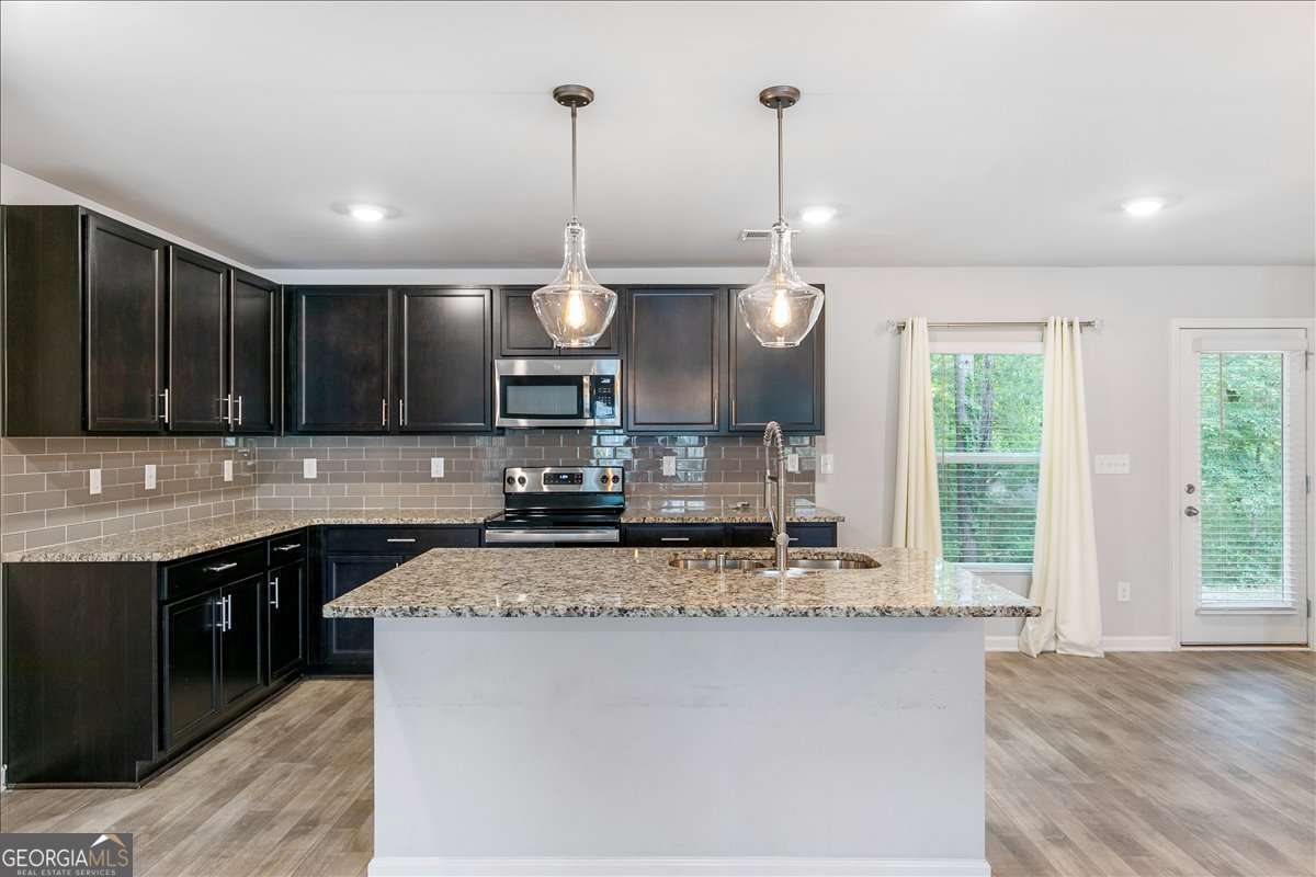 4 bedroom, 2.5 bathroom, 2,322 sq ft single family residence for sale at 6426 Beaver Creek Trail, South Fulton, GA 30349 — photo 3