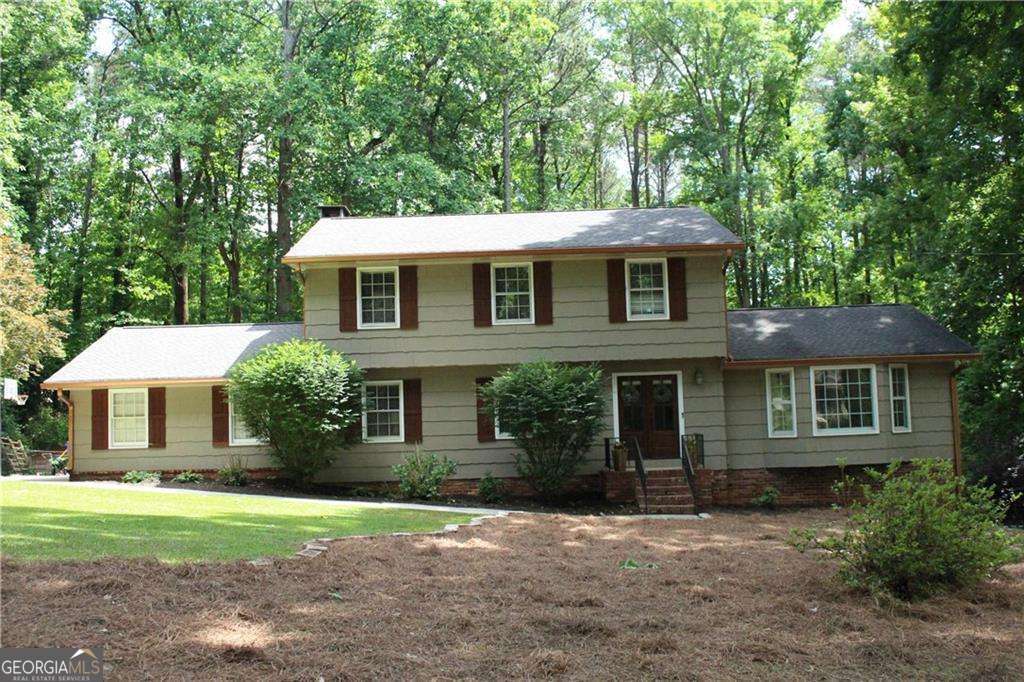 6 bedroom, 3 bathroom, 3,647 sq ft single family residence sold at 4989 Mountclaire Road, Stone Mountain, GA 30087