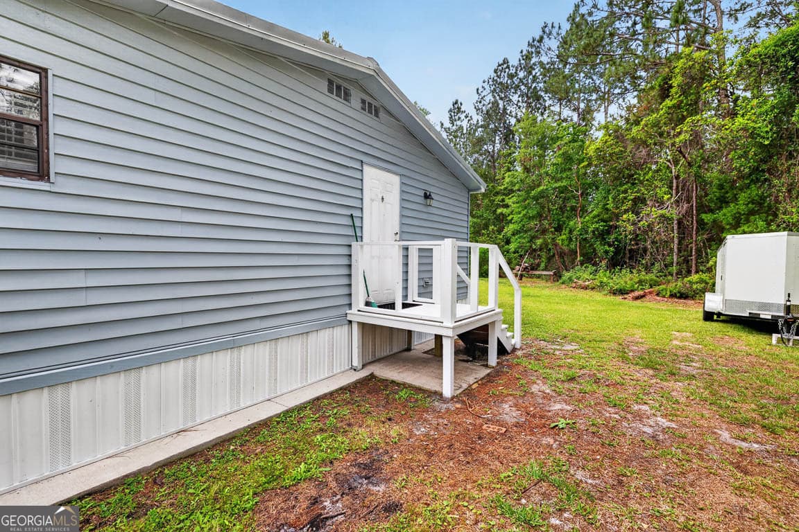 3 bedroom, 2 bathroom, 1,440 sq ft manufactured home,single family residence for sale at 155 Pine Crossing Street, Woodbine, GA 31569 — photo 6
