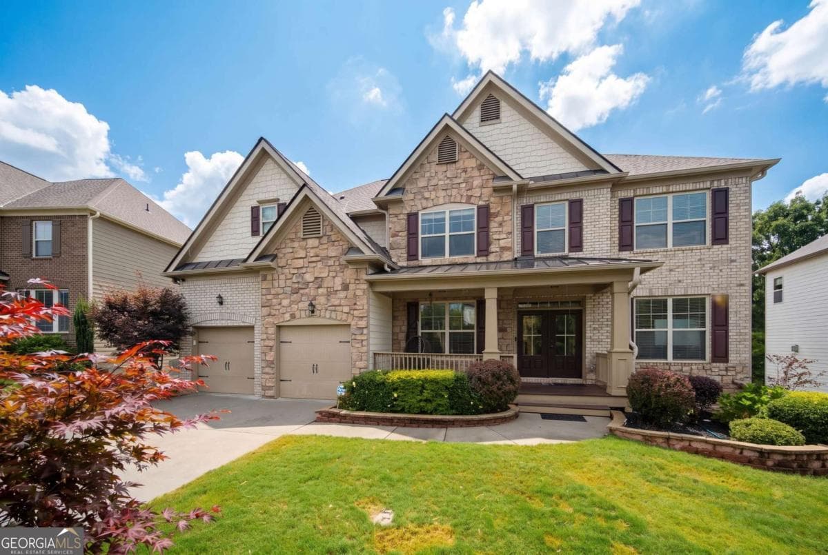 6 bedroom, 5 bathroom, 6,100 sq ft single family residence for sale at 4090 Tobiano Trail, Cumming, GA 30040 — photo 2
