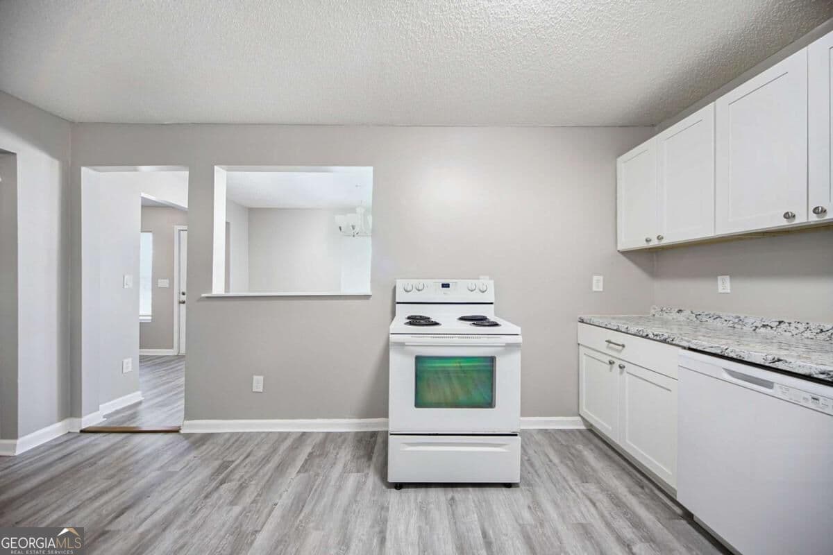 4 bedroom, 2 bathroom, 1,344 sq ft single family residence for sale at 1367 Railroad Avenue, Sugar Hill, GA 30518 — photo 7