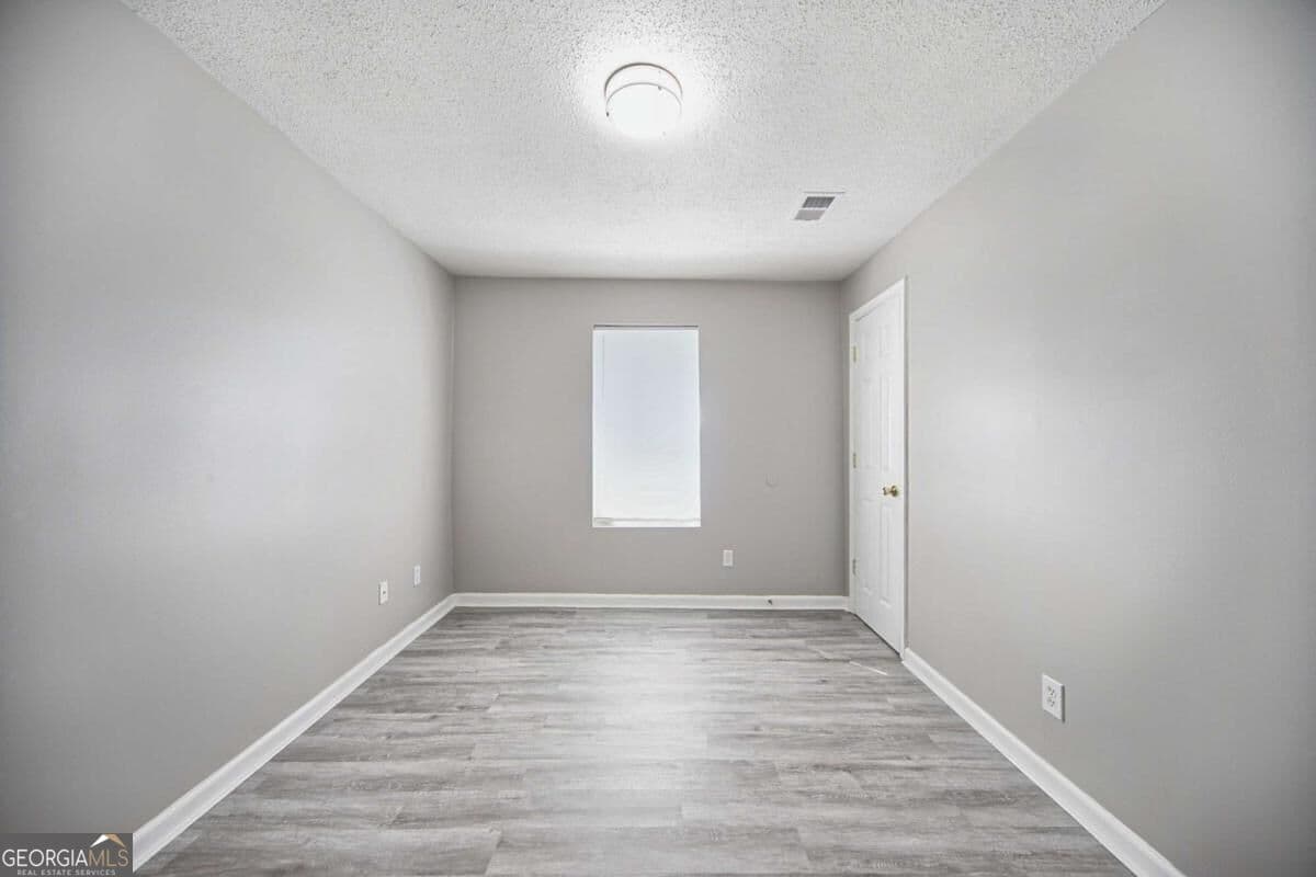 4 bedroom, 2 bathroom, 1,344 sq ft single family residence for sale at 1367 Railroad Avenue, Sugar Hill, GA 30518 — photo 9