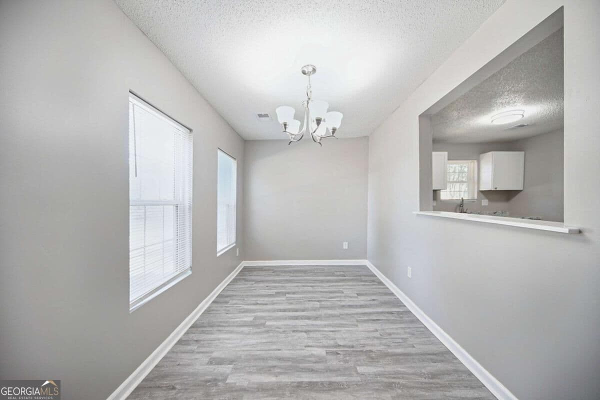 4 bedroom, 2 bathroom, 1,344 sq ft single family residence for sale at 1367 Railroad Avenue, Sugar Hill, GA 30518 — photo 4
