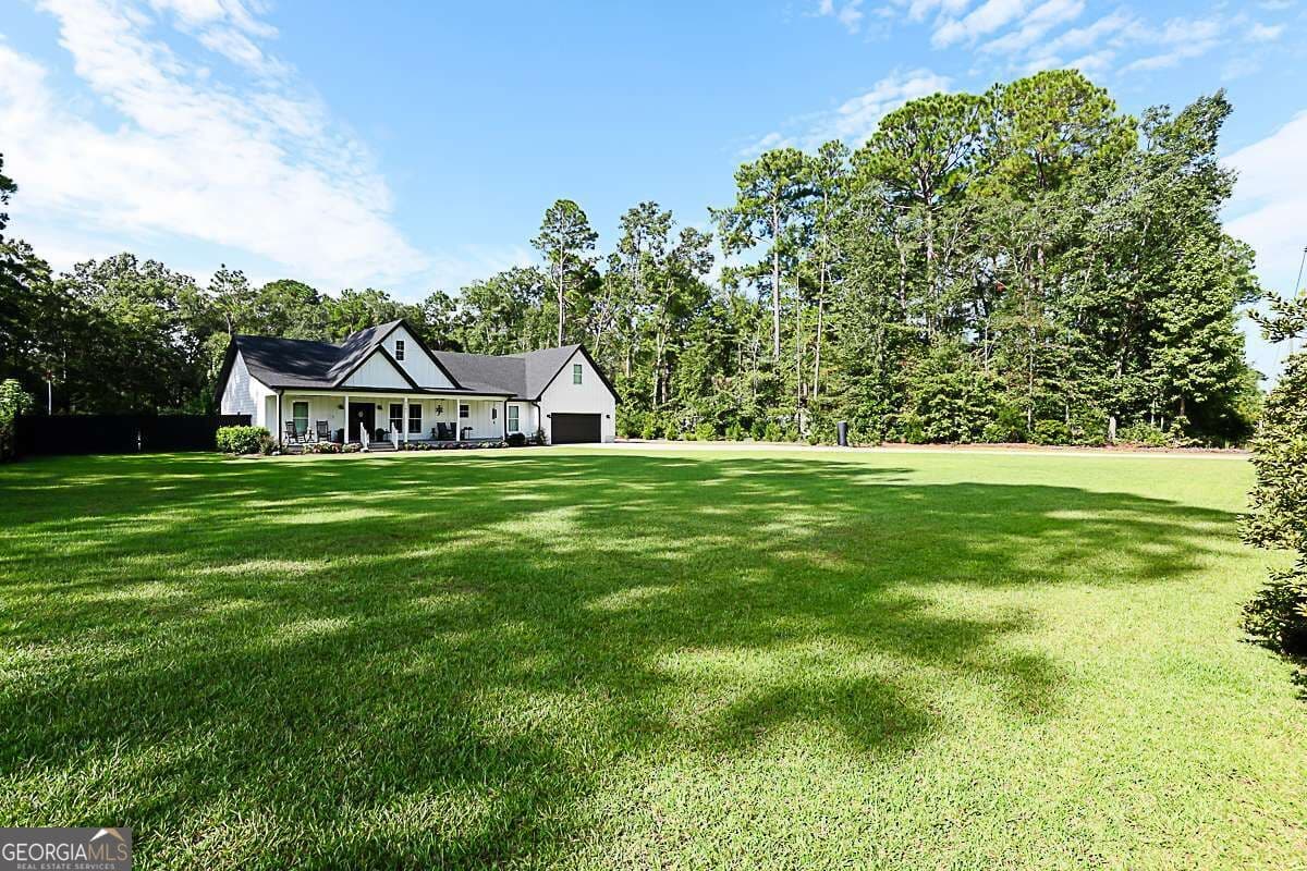 4 bedroom, 3.5 bathroom, 2,270 sq ft single family residence for sale at 5302 Mccall Road, Rincon, GA 31326 — photo 2