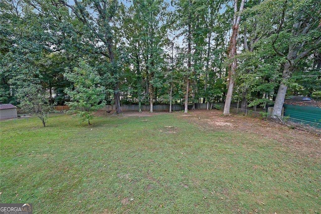 5 bedroom, 3 bathroom, 1,632 sq ft single family residence for sale at 773 Rebecca Street, Lilburn, GA 30047 — photo 2
