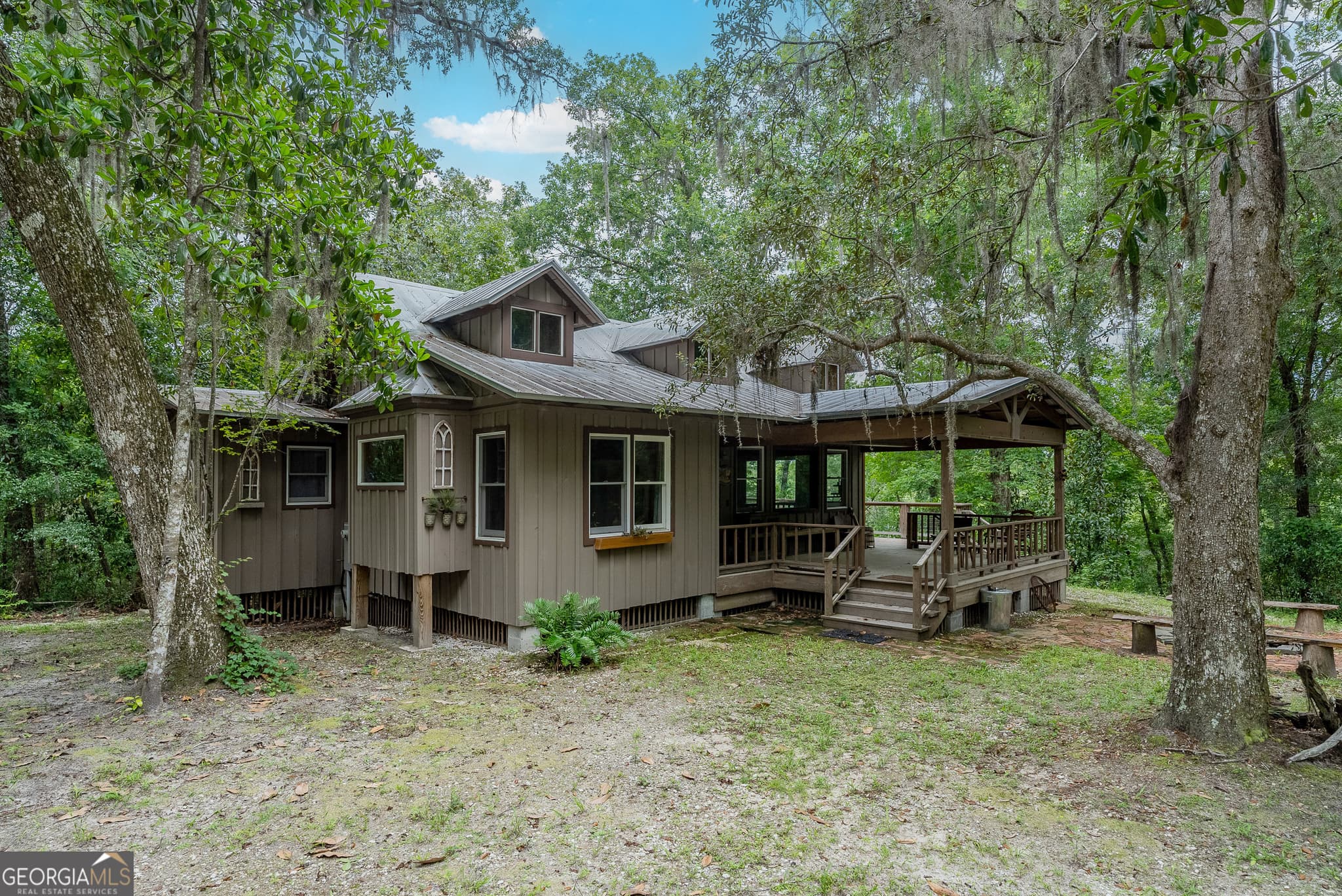 2 bedroom, 2 bathroom, 1,500 sq ft cabin,single family residence for sale at 1360 Douglas Fish Camp Road, White Oak, GA 31568