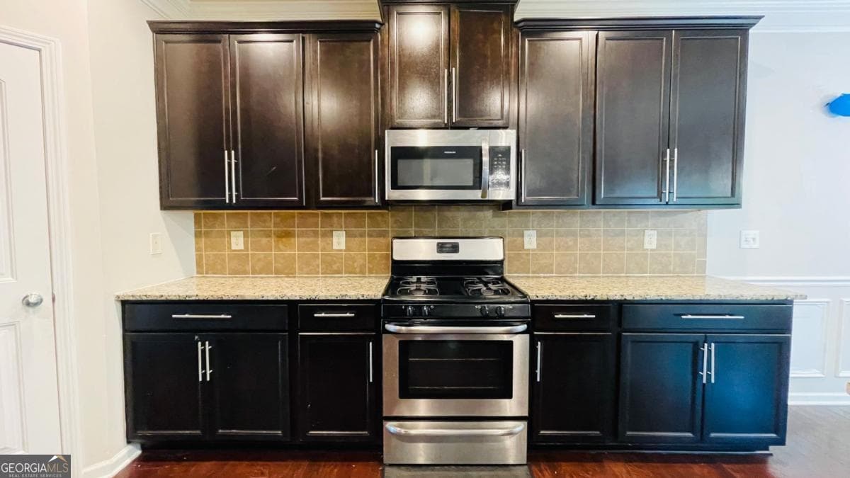 4 bedroom, 3.5 bathroom, 3,164 sq ft single family residence for sale at 1673 Wilson Manor Circle, Lawrenceville, GA 30045 — photo 6