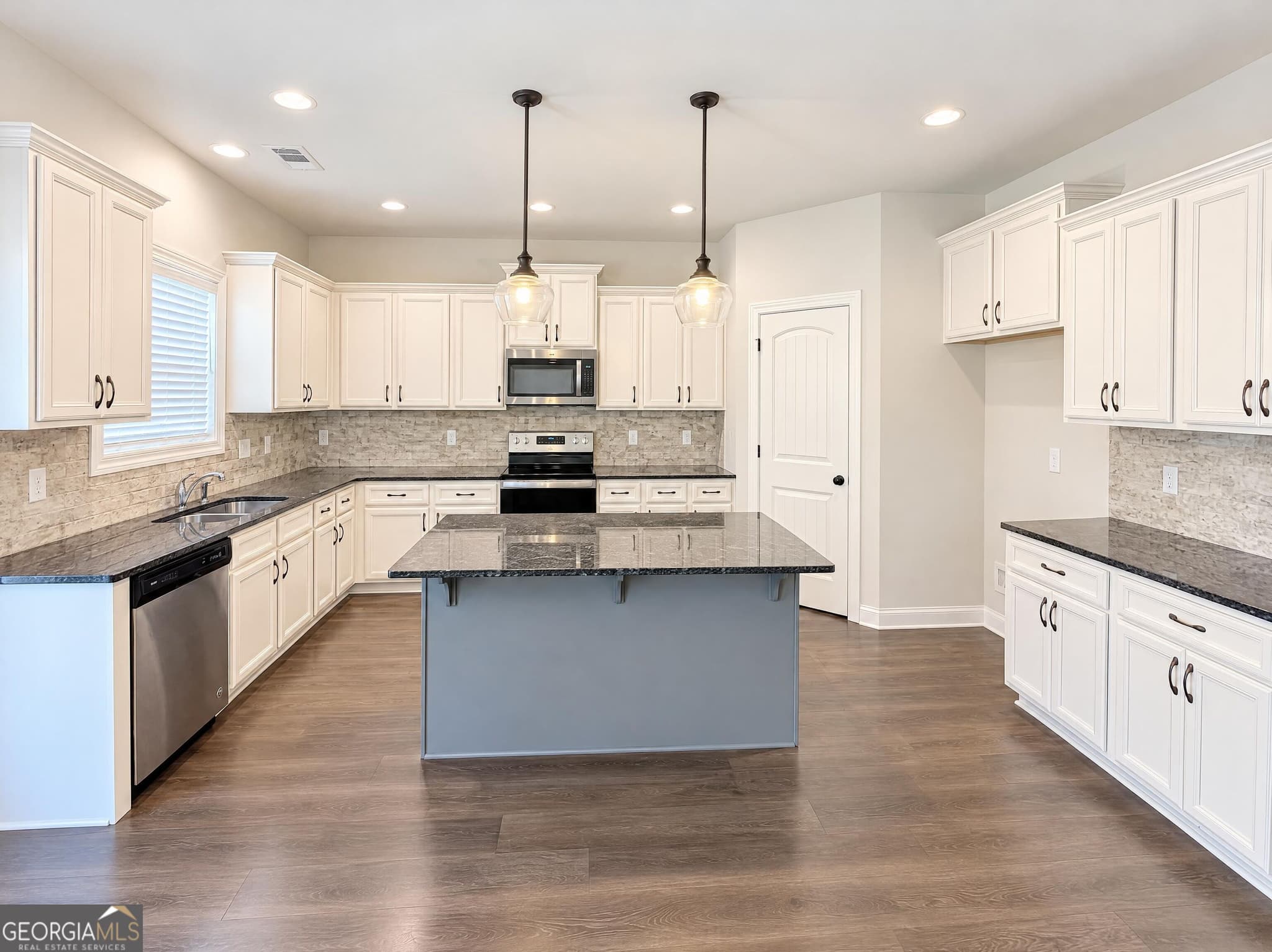 4 bedroom, 3.5 bathroom, 3,791 sq ft single family residence for sale at 1801 Sycamore Drive, Loganville, GA 30052 — photo 2