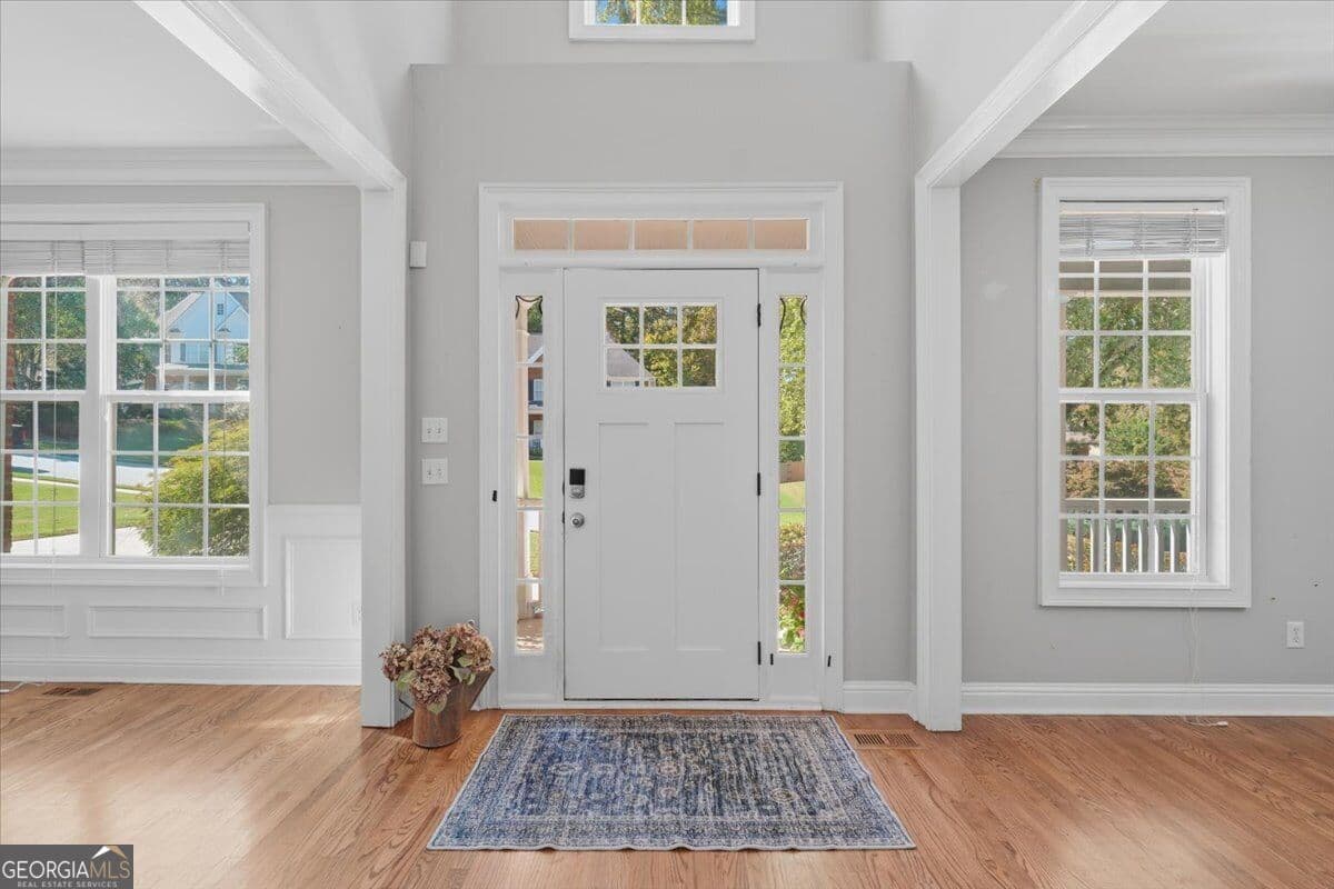 7 bedroom, 4 bathroom, 3,803 sq ft single family residence for sale at 6180 Lake Windsor Parkway, Buford, GA 30518 — photo 3