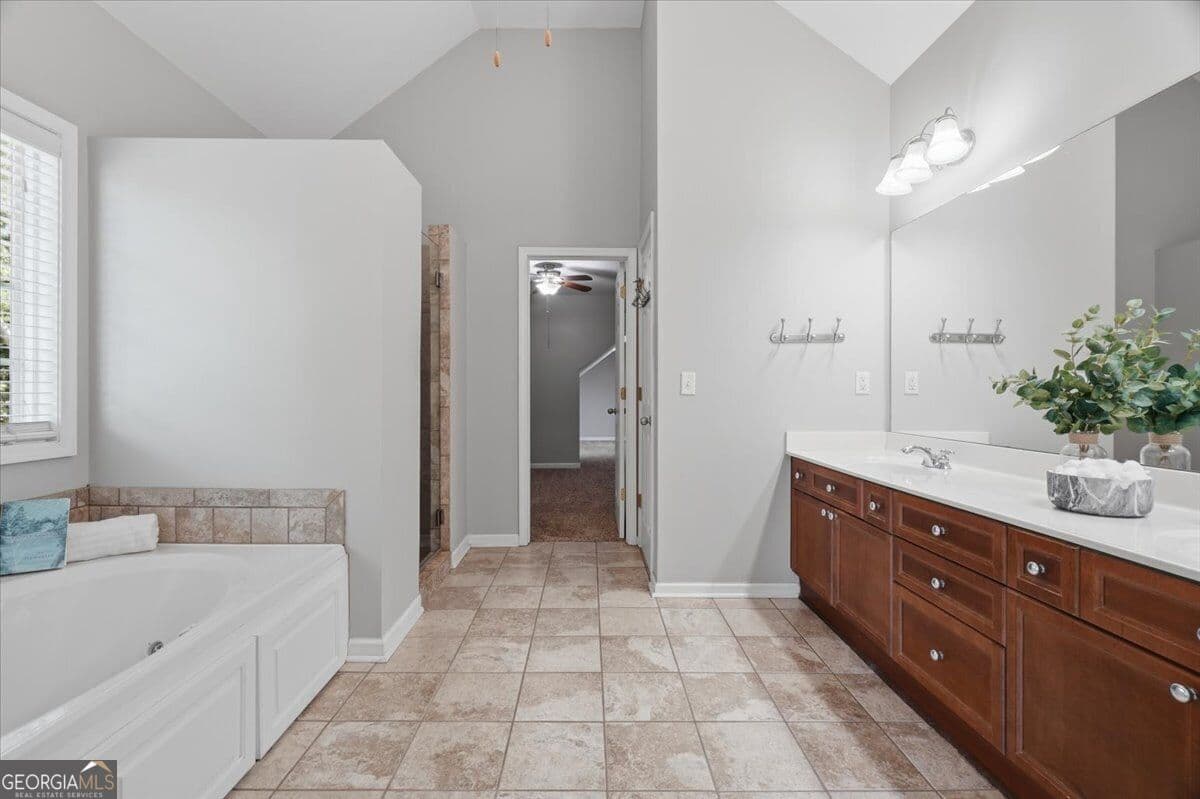 7 bedroom, 4 bathroom, 3,803 sq ft single family residence for sale at 6180 Lake Windsor Parkway, Buford, GA 30518 — photo 8