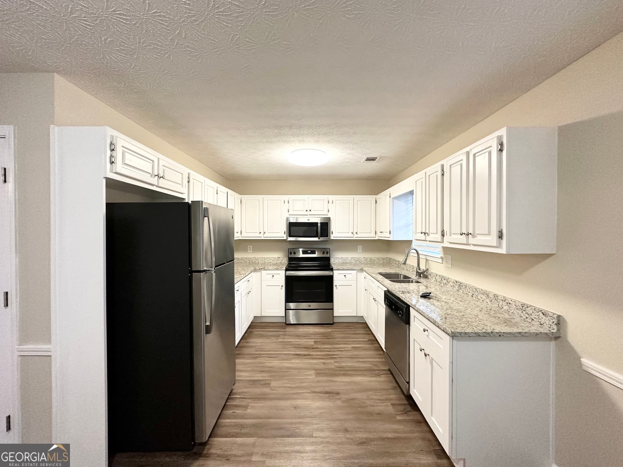 3 bedroom, 2 bathroom, 1,476 sq ft single family residence for sale at 1641 NE Riverchase Circle, Conyers, GA 30013 — photo 6