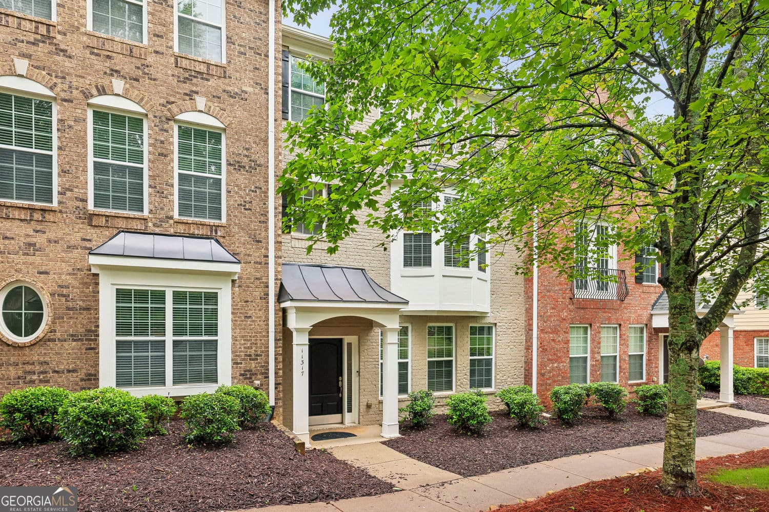 4 bedroom, 3.5 bathroom, 2,448 sq ft townhouse sold at 11317 Musette Circle, Alpharetta, GA 30009