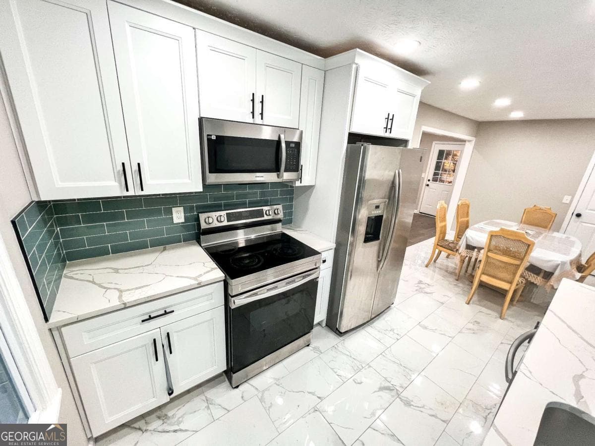 4 bedroom, 3 bathroom single family residence for sale at 6875 Graves Mill Court, Norcross, GA 30093 — photo 8