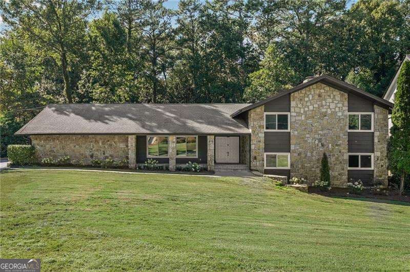 5 bedroom, 3.5 bathroom, 3,800 sq ft single family residence for sale at 675 Weatherly Lane, Sandy Springs, GA 30328 — photo 1 of 54
