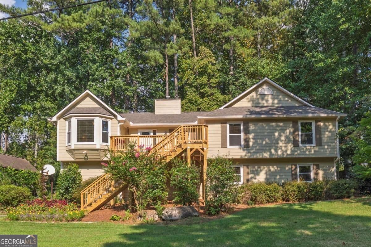 4 bedroom, 3 bathroom, 2,242 sq ft single family residence for sale at 2363 Wilderness Way, Marietta, GA 30066 — photo 1 of 44