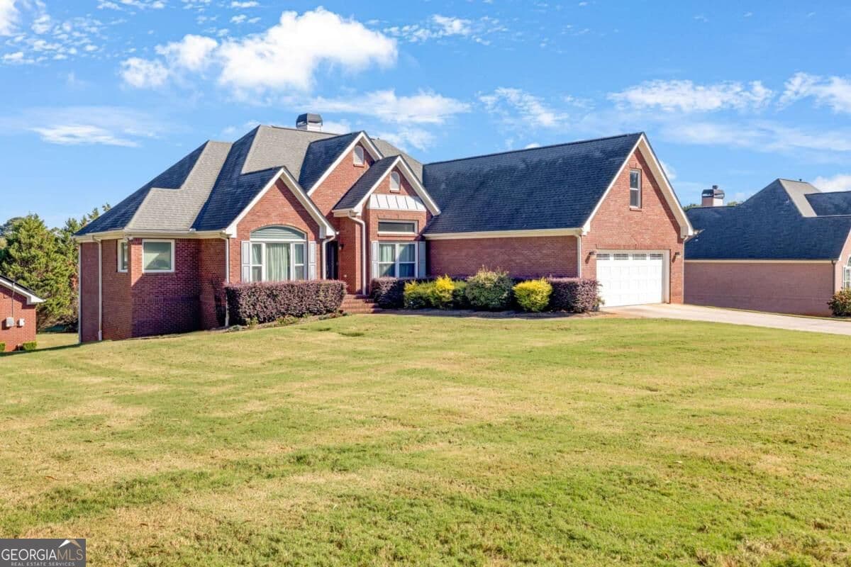 5 bedroom, 4 bathroom, 4,874 sq ft single family residence for sale at 1001 Landmark Drive, Mcdonough, GA 30252 — photo 1 of 36