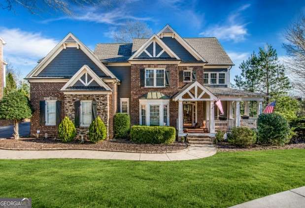 6 bedroom, 5 bathroom, 4,845 sq ft single family residence for sale at 6011 Lost Maple Lane, Buford, GA 30518 — photo 1 of 48