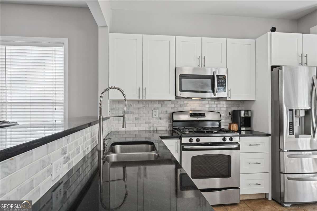 3 bedroom, 2.5 bathroom, 1,435 sq ft single family residence under contract at 1311 Timuquana Trail, Woodstock, GA 30188 — photo 4