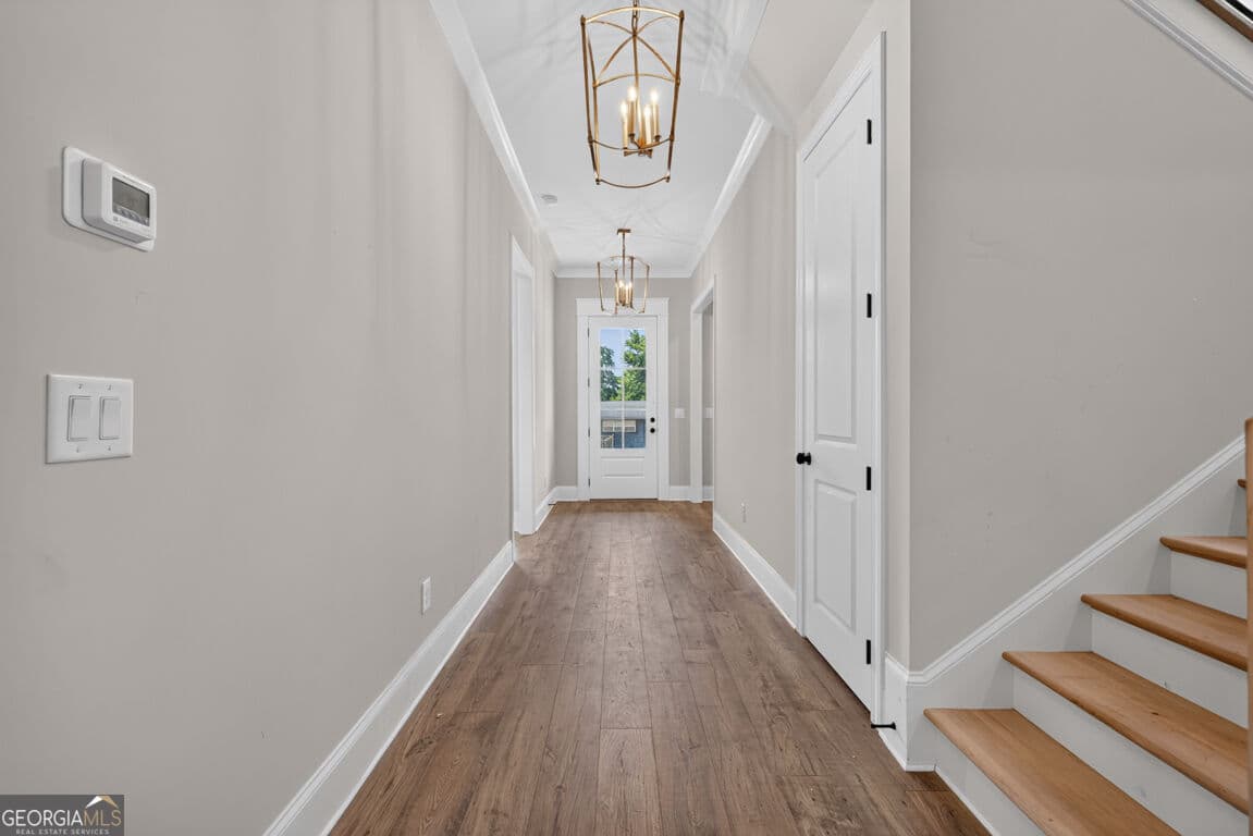 4 bedroom, 3.5 bathroom, 3,112 sq ft single family residence for sale at 5808 Mitchell Street, Flowery Branch, GA 30542 — photo 3