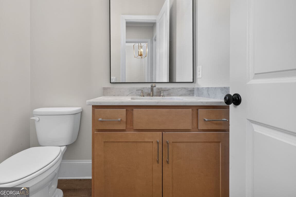 4 bedroom, 3.5 bathroom, 3,112 sq ft single family residence for sale at 5808 Mitchell Street, Flowery Branch, GA 30542 — photo 5