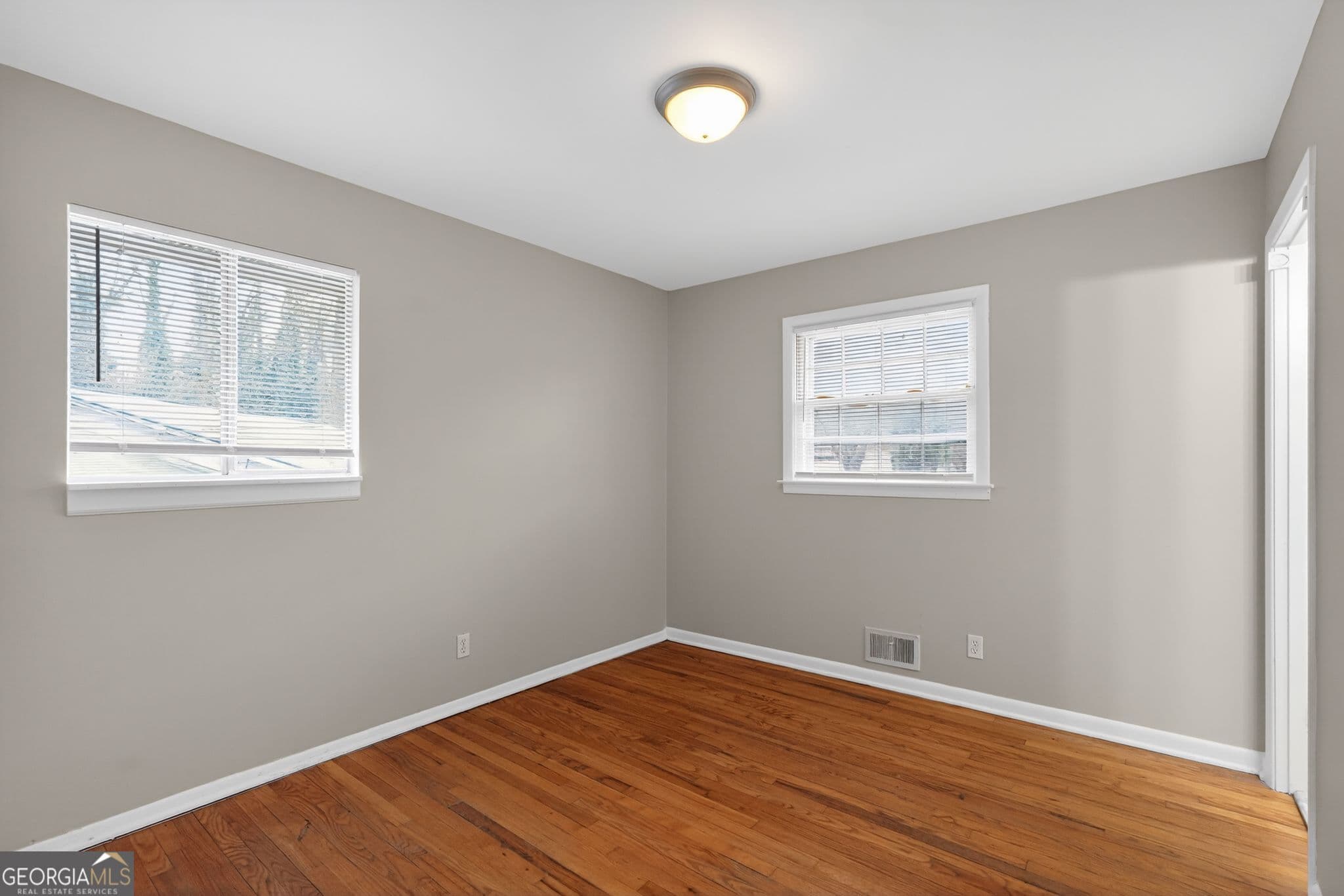 4 bedroom, 2.5 bathroom, 1,612 sq ft single family residence for sale at 5700 Deerfield Trail, Atlanta, GA 30349 — photo 7