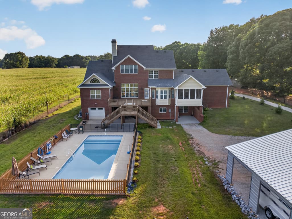 5 bedroom, 4.5 bathroom, 6,656 sq ft single family residence for sale at 1200 Woodlawn Road, Mansfield, GA 30055 — photo 2