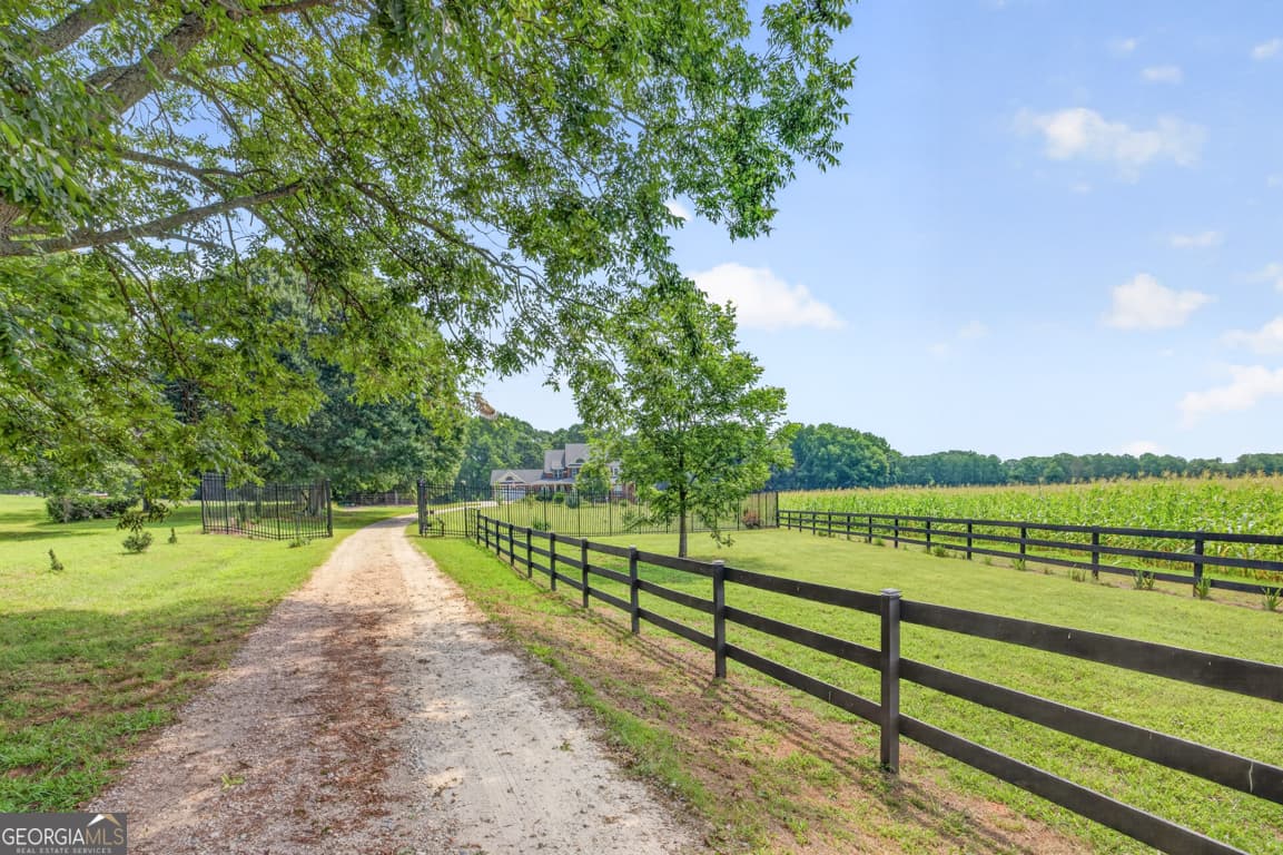 5 bedroom, 4.5 bathroom, 6,656 sq ft single family residence for sale at 1200 Woodlawn Road, Mansfield, GA 30055 — photo 6