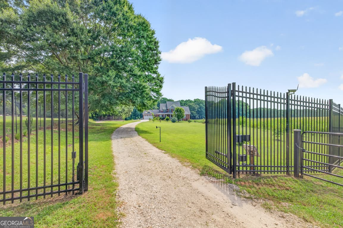 5 bedroom, 4.5 bathroom, 6,656 sq ft single family residence for sale at 1200 Woodlawn Road, Mansfield, GA 30055 — photo 5