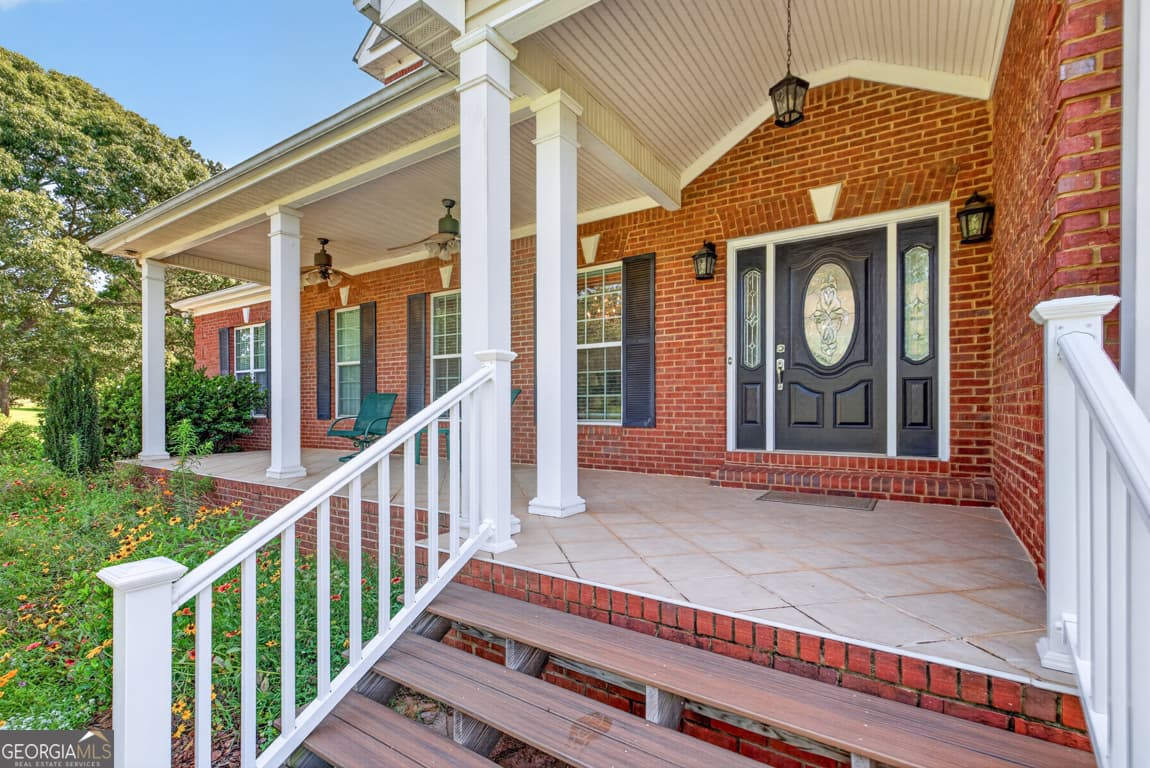 5 bedroom, 4.5 bathroom, 6,656 sq ft single family residence for sale at 1200 Woodlawn Road, Mansfield, GA 30055 — photo 10