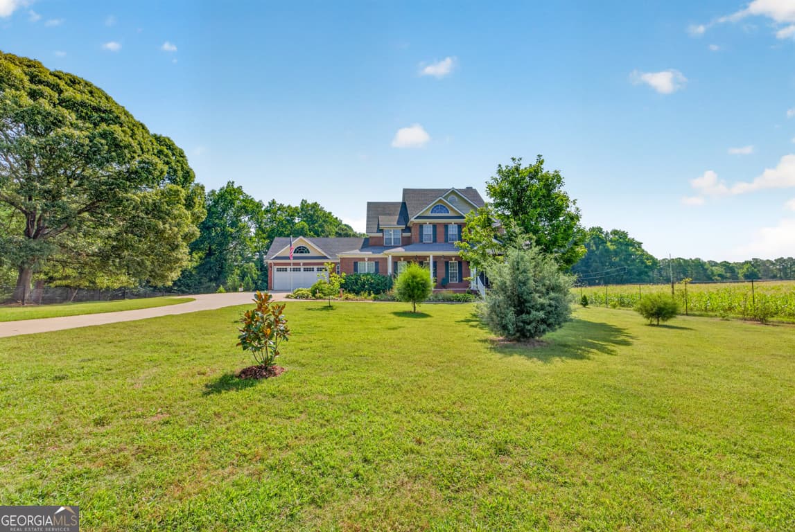 5 bedroom, 4.5 bathroom, 6,656 sq ft single family residence for sale at 1200 Woodlawn Road, Mansfield, GA 30055 — photo 8