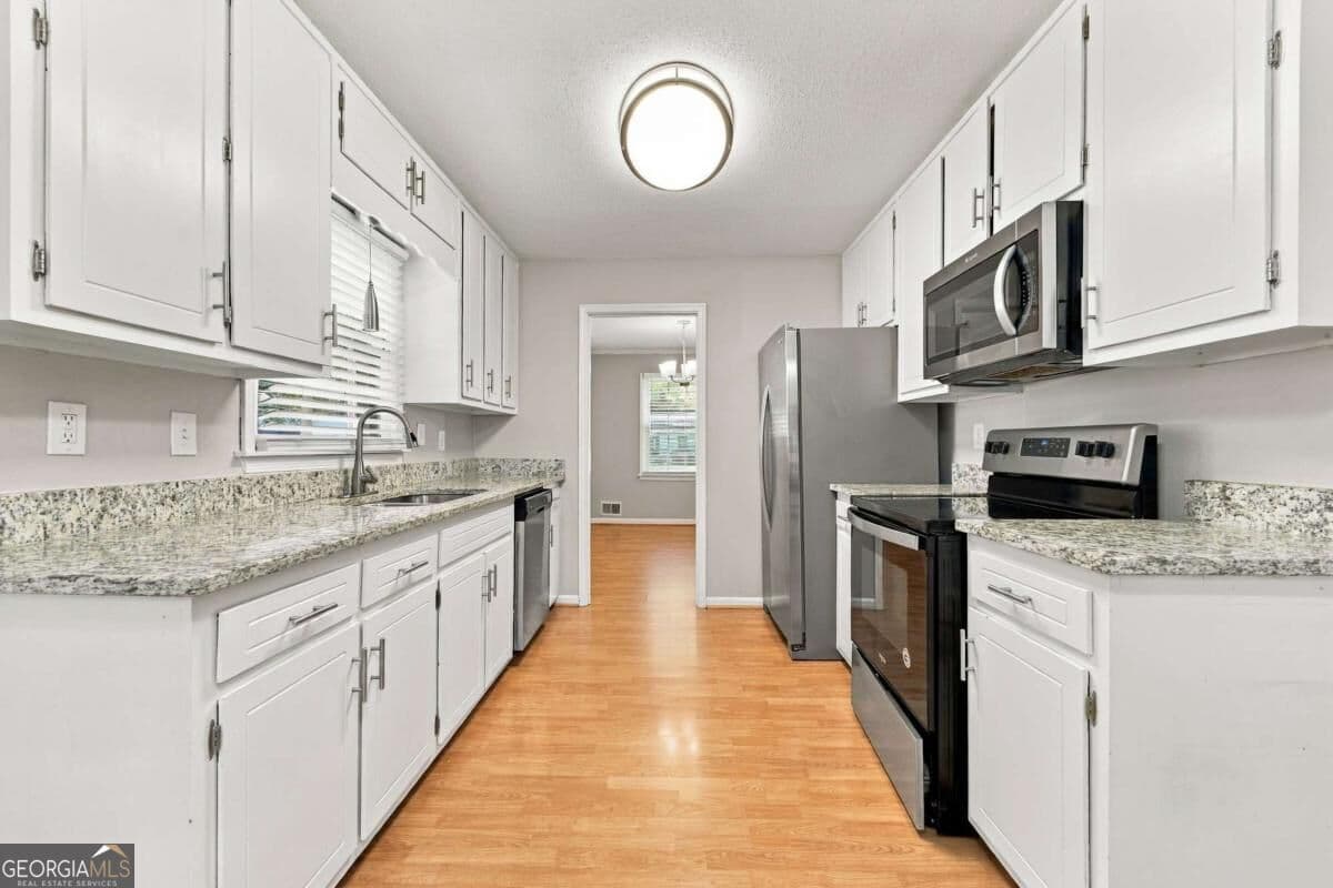 3 bedroom, 2.5 bathroom, 1,550 sq ft single family residence for sale at 1730 Saint Lawrence Cove, Tucker, GA 30084 — photo 5