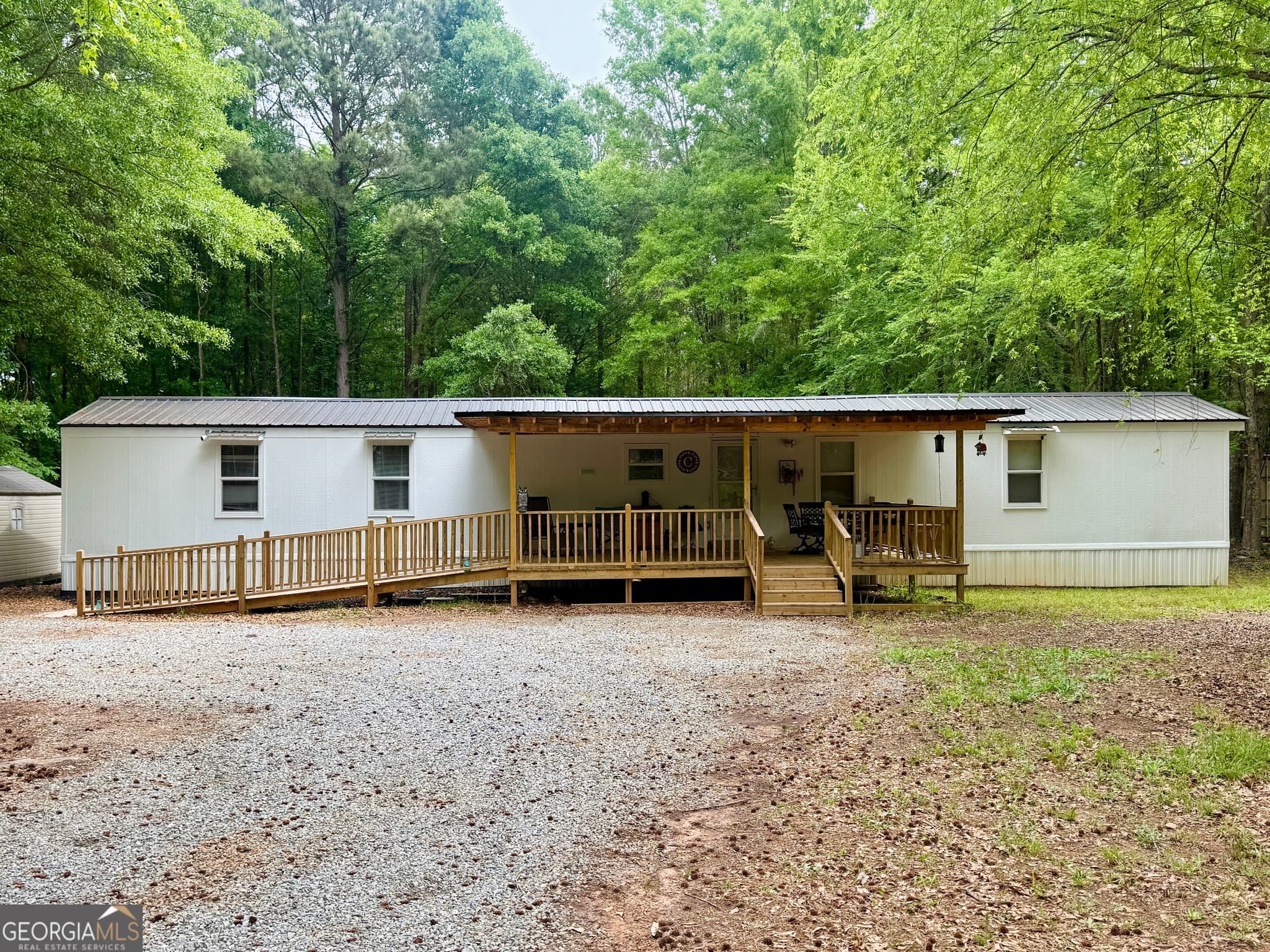 3 bedroom, 2 bathroom, 1,064 sq ft manufactured home,single family residence sold at 1350 Kline Road, Shady Dale, GA 31085