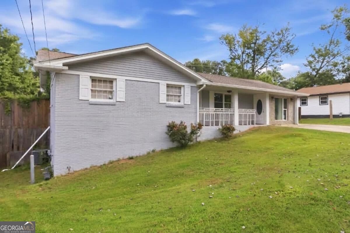 6 bedroom, 4 bathroom, 1,148 sq ft single family residence for sale at 1594 Dellwood Circle, Morrow, GA 30260 — photo 2