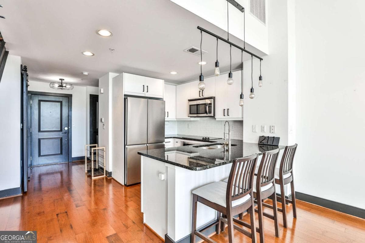 1 bedroom, 1.5 bathroom, 1,072 sq ft loft,condominium for sale at 1261 CAROLINE Street 211, Atlanta, GA 30307 — photo 3