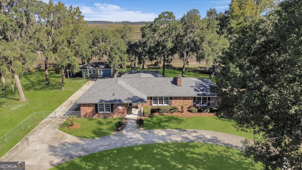 4 bedroom, 3 bathroom single family residence for sale at 1613 Lake Drive, Midway, GA 31320 — photo 2