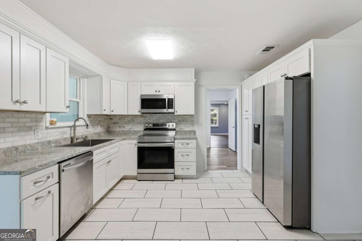 4 bedroom, 3 bathroom single family residence for sale at 1613 Lake Drive, Midway, GA 31320 — photo 3