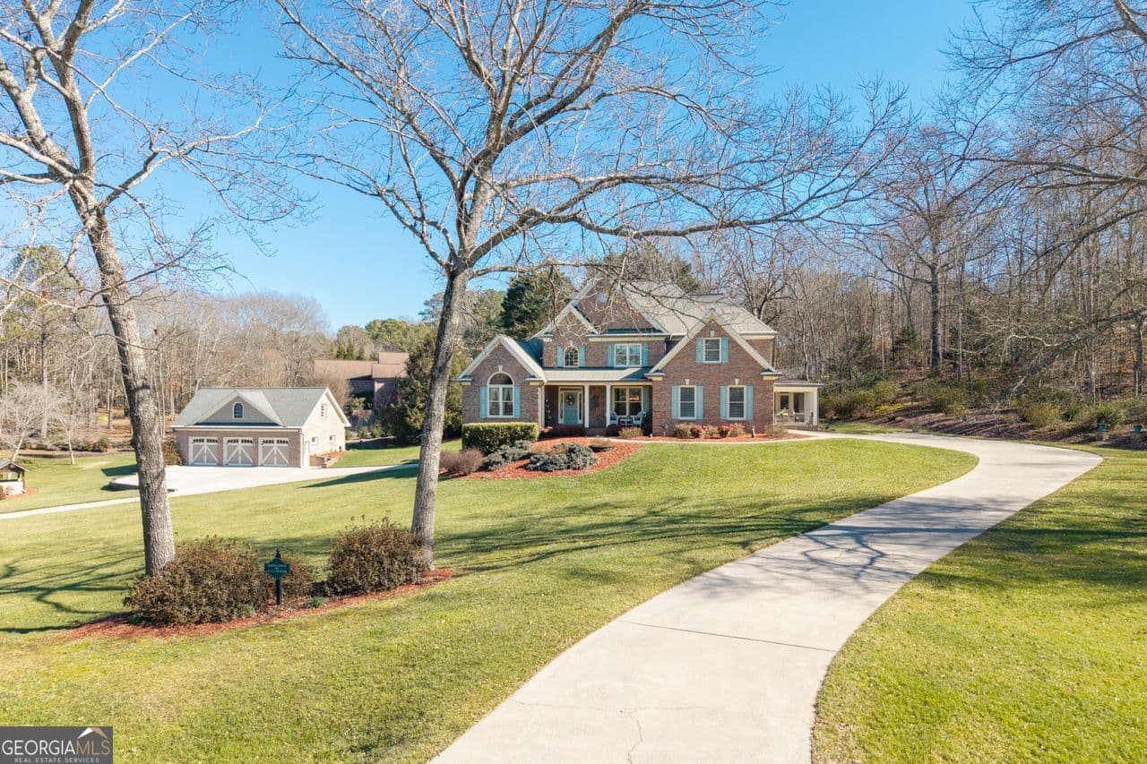 4 bedroom, 3.5 bathroom, 5,774 sq ft single family residence for sale at 8015 Hurakan Creek Crossing, Cumming, GA 30028 — photo 2