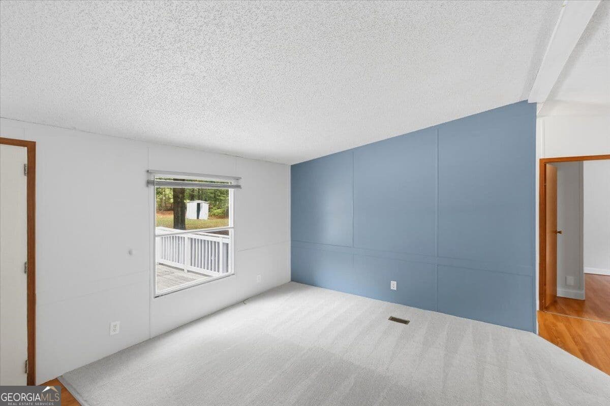 3 bedroom, 2 bathroom, 1,056 sq ft manufactured home,single family residence for sale at 312 Blounts Chapel Road, Haddock, GA 31033 — photo 5