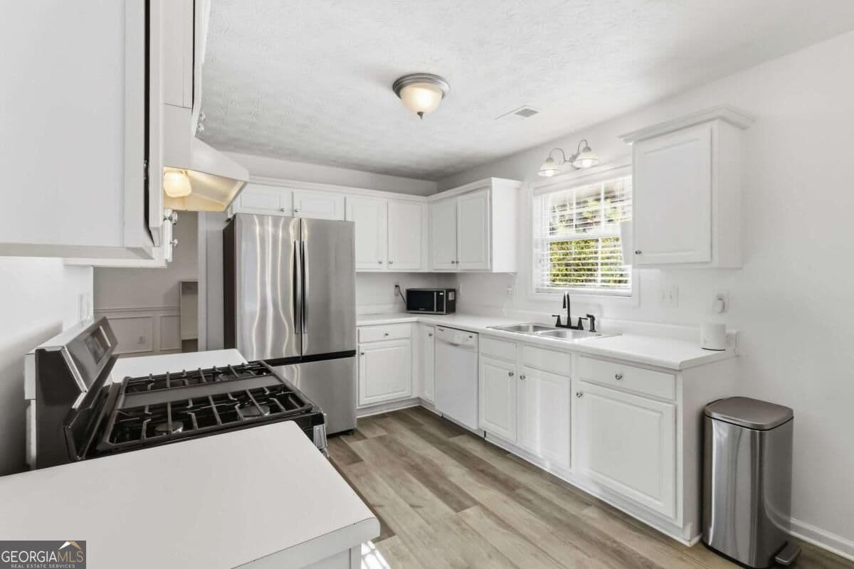 4 bedroom, 2.5 bathroom, 1,922 sq ft single family residence for sale at 2800 General Lee Way, Buford, GA 30519 — photo 7