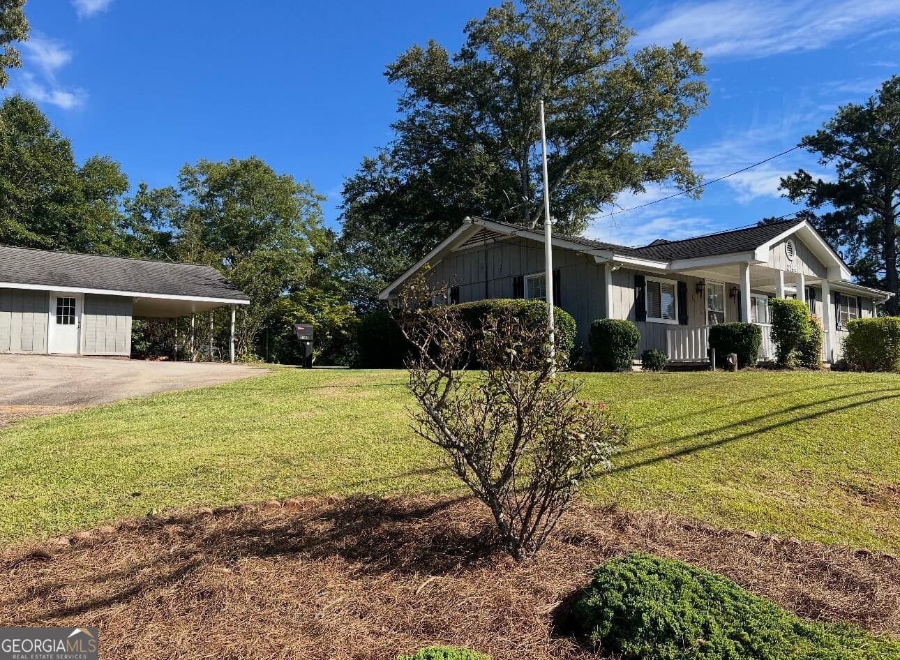 3 bedroom, 1.5 bathroom, 1,880 sq ft single family residence for sale at 3144 Highway 20, Conyers, GA 30013 — photo 2