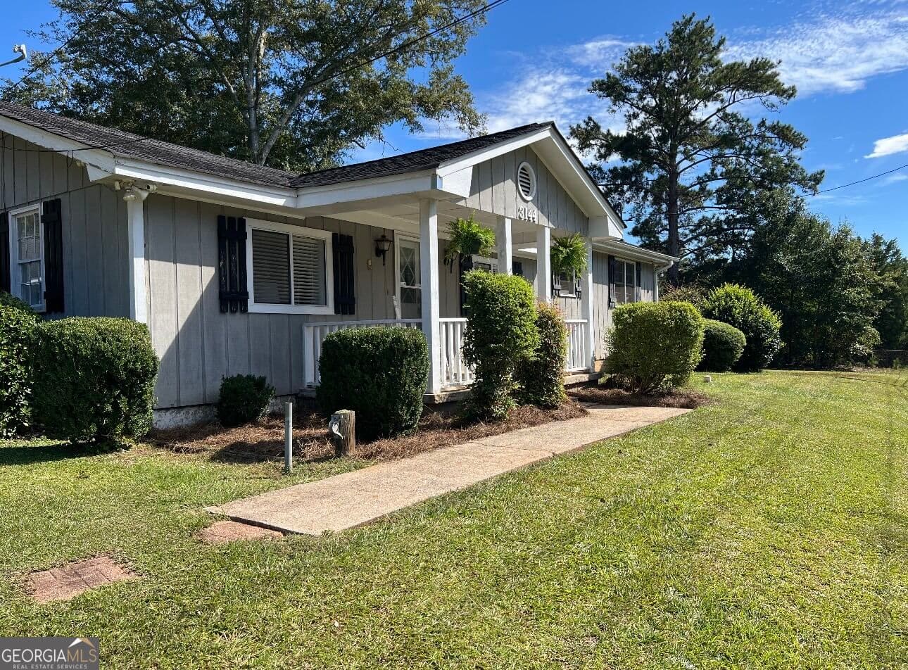 3 bedroom, 1.5 bathroom, 1,880 sq ft single family residence for sale at 3144 Highway 20, Conyers, GA 30013 — photo 3