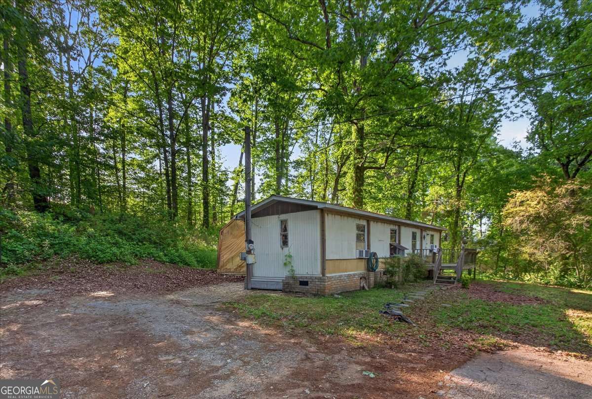 2 bedroom, 1 bathroom, 650 sq ft manufactured home,single family residence for sale at 2024 Ball Ground Highway, Canton, GA 30114 — photo 2