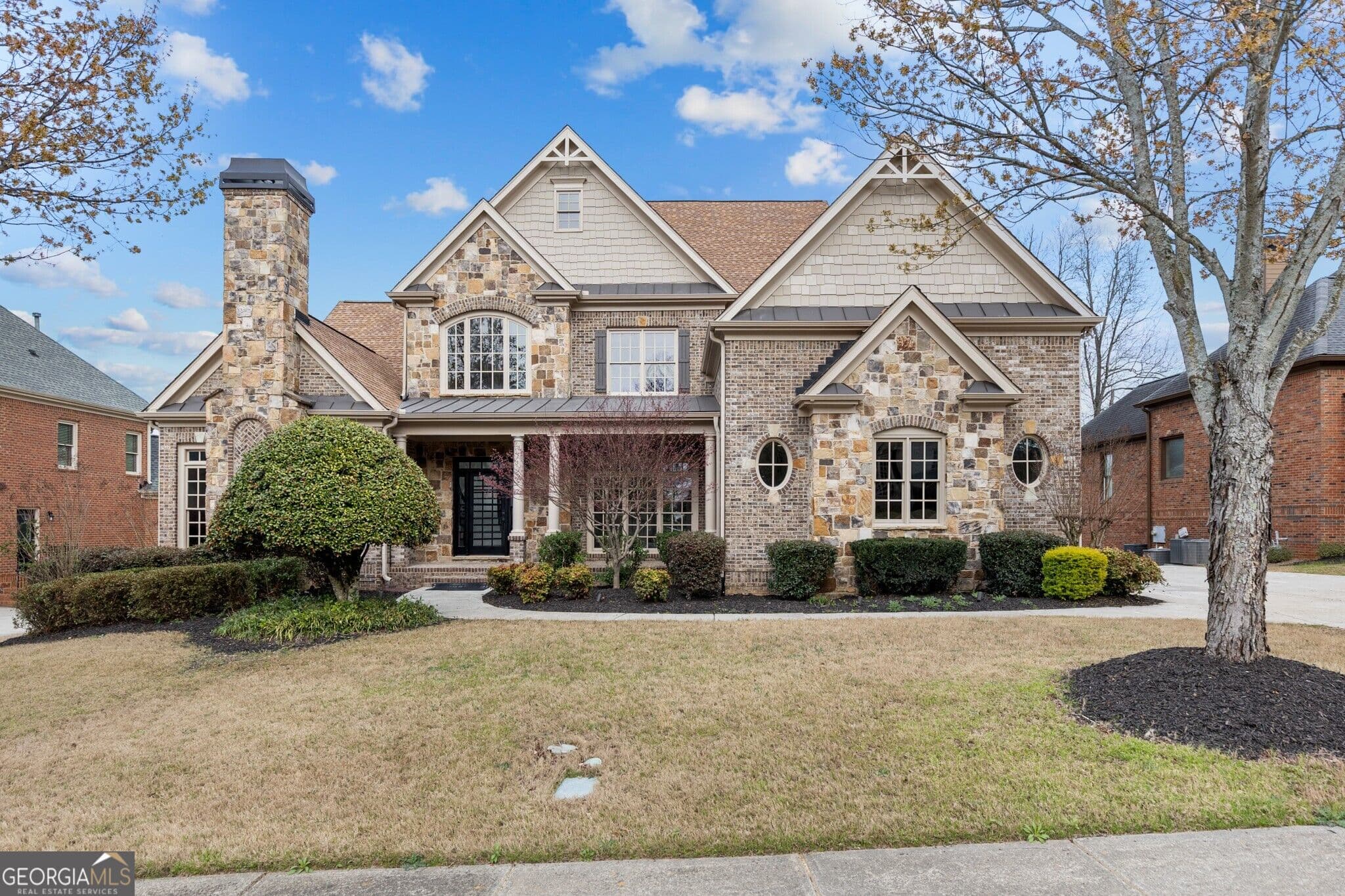 6 bedroom, 5.5 bathroom, 7,604 sq ft single family residence for sale at 2302 Walkers Glen Lane, Buford, GA 30519 — photo 1 of 83