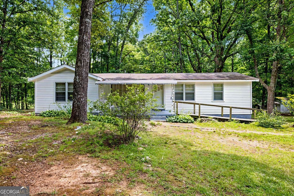 4 bedroom, 2 bathroom, 1,280 sq ft single family residence for sale at 1665 Kansas Jake Road, Waco, GA 30182 — photo 2