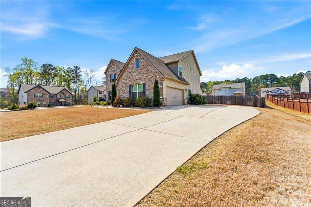 5 bedroom, 3.5 bathroom, 3,496 sq ft single family residence for sale at 801 Relic Ridge, Hampton, GA 30228 — photo 2