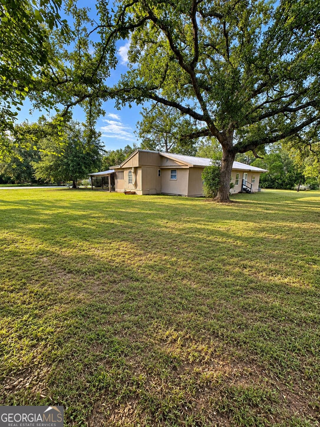 4 bedroom, 1.5 bathroom, 1,280 sq ft manufactured home,single family residence for sale at 118 Mosley Street, Reidsville, GA 30453 — photo 2