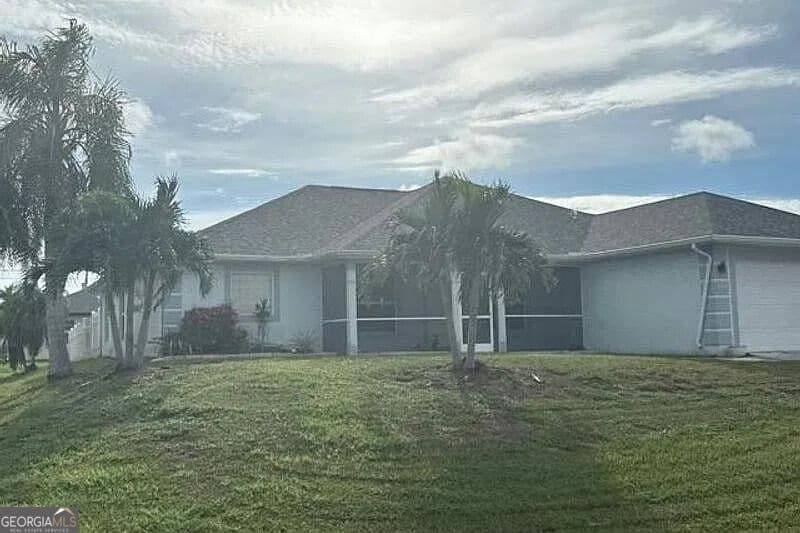 3 bedroom, 2 bathroom, 2,035 sq ft single family residence for sale at 235 NW 25th Place, Cape Coral, FL 33993 — photo 2